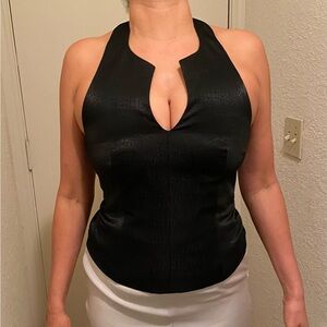 Vintage halter top with hidden zipper and button closure at neck line. NWT.